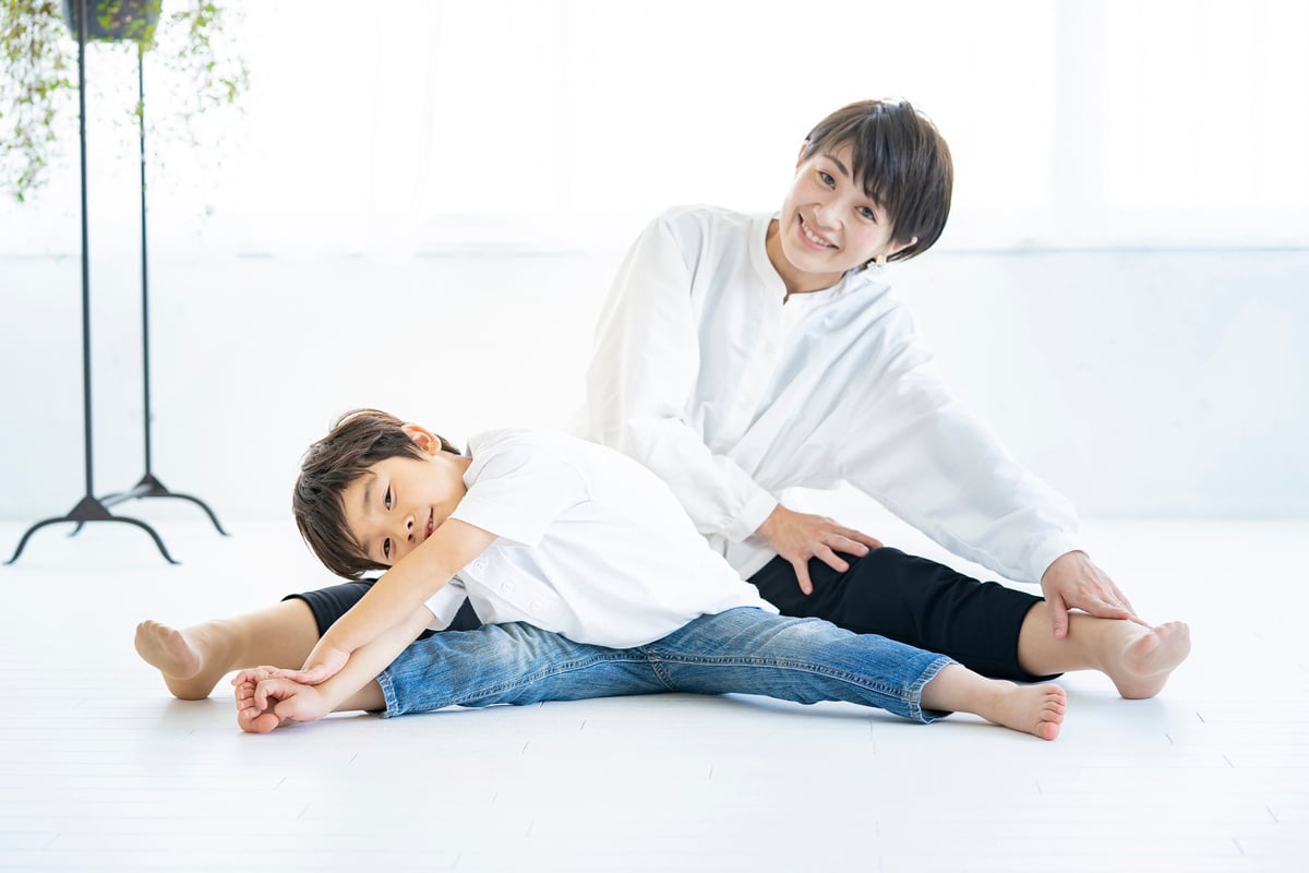 Parent and child doing yoga